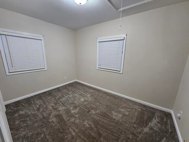 an empty room with windows