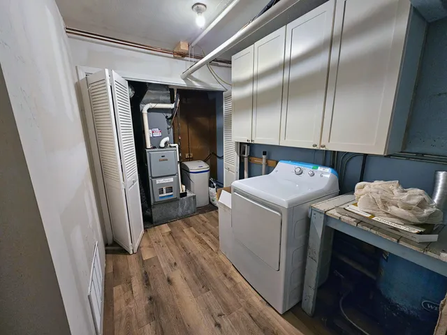 a view of hallway with wooden floor