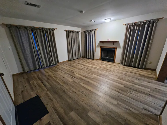 wooden floor in a hall with an entryway