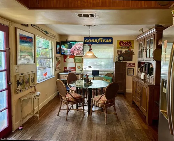 a bedroom with a bed and cabinet