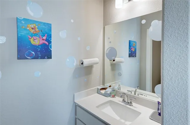 a bathroom with a sink and a bathtub