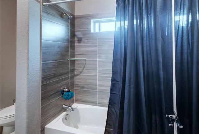 a bathroom with a sink and a mirror with toilet