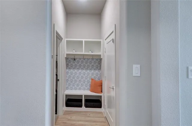 a view of a workspace with a window and chair