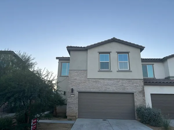 a front view of a house with yard