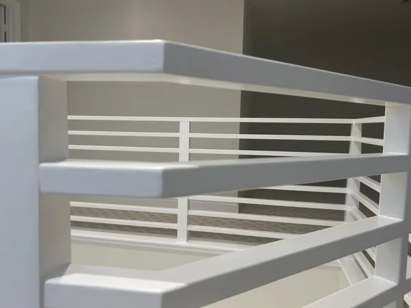 a view of staircase with lots of frames on wall