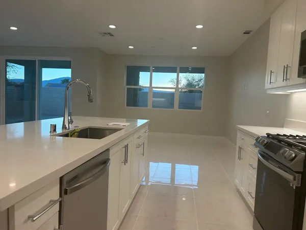 a kitchen with a refrigerator stove and microwave