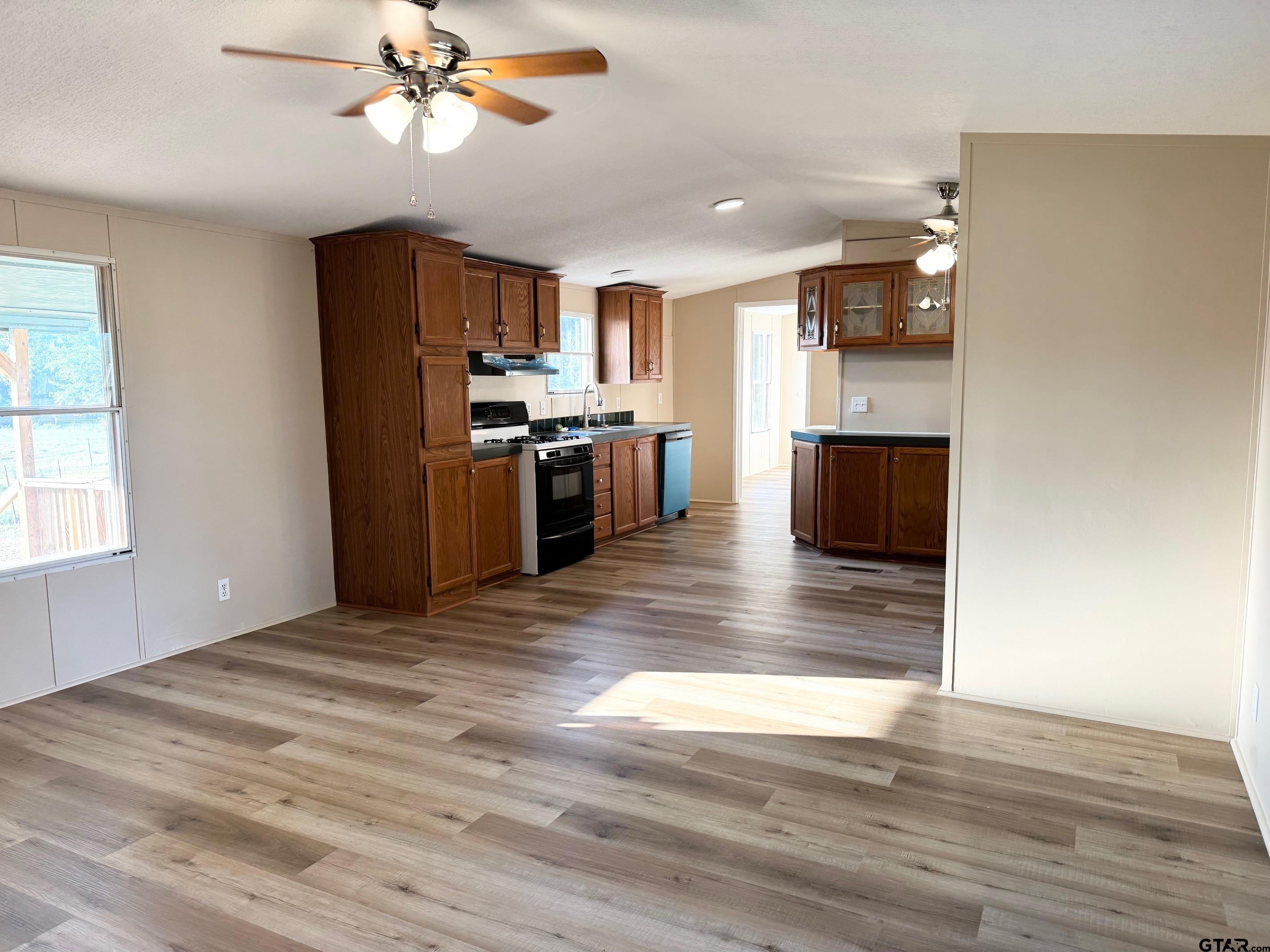427 Old Latexo Road Grapeland, TX 75844 - Photo 7 of 18 a view of kitchen with sink microwave and refrigerator