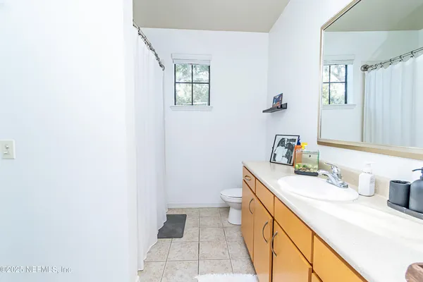 a bathroom with a sink a vanity and a mirror