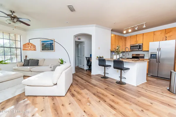 a living room with furniture and a table