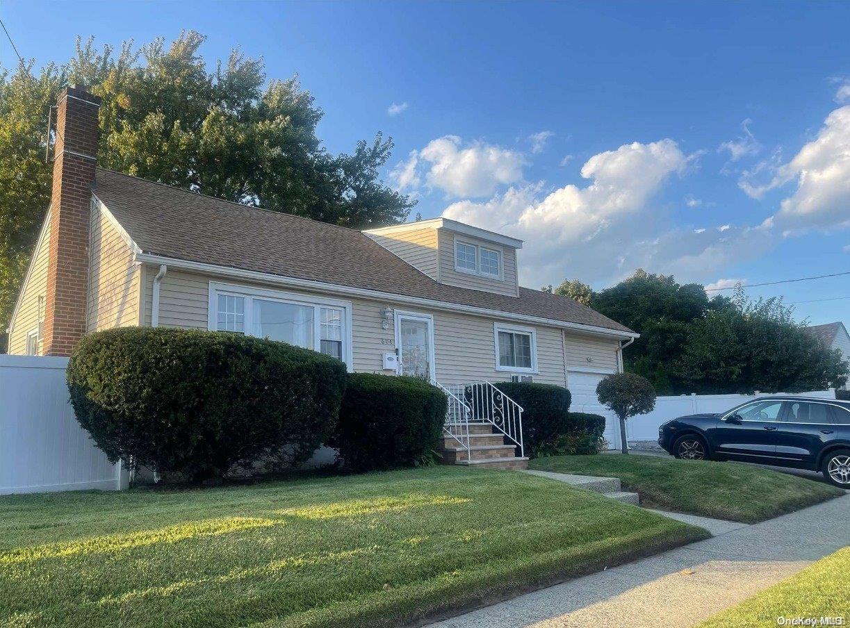 a view of a house with couches in front of house