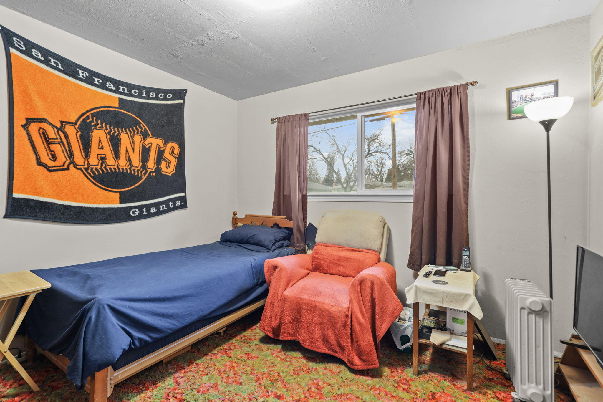 6725 Reflection Street Redding, CA 96001 - Photo 14 of 20 a bedroom with a bed and a window