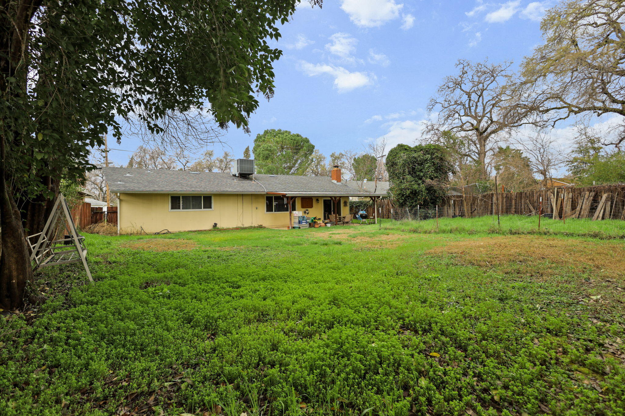 6725 Reflection Street Redding, CA 96001 - Photo 17 of 20 a front view of house with yard and green space
