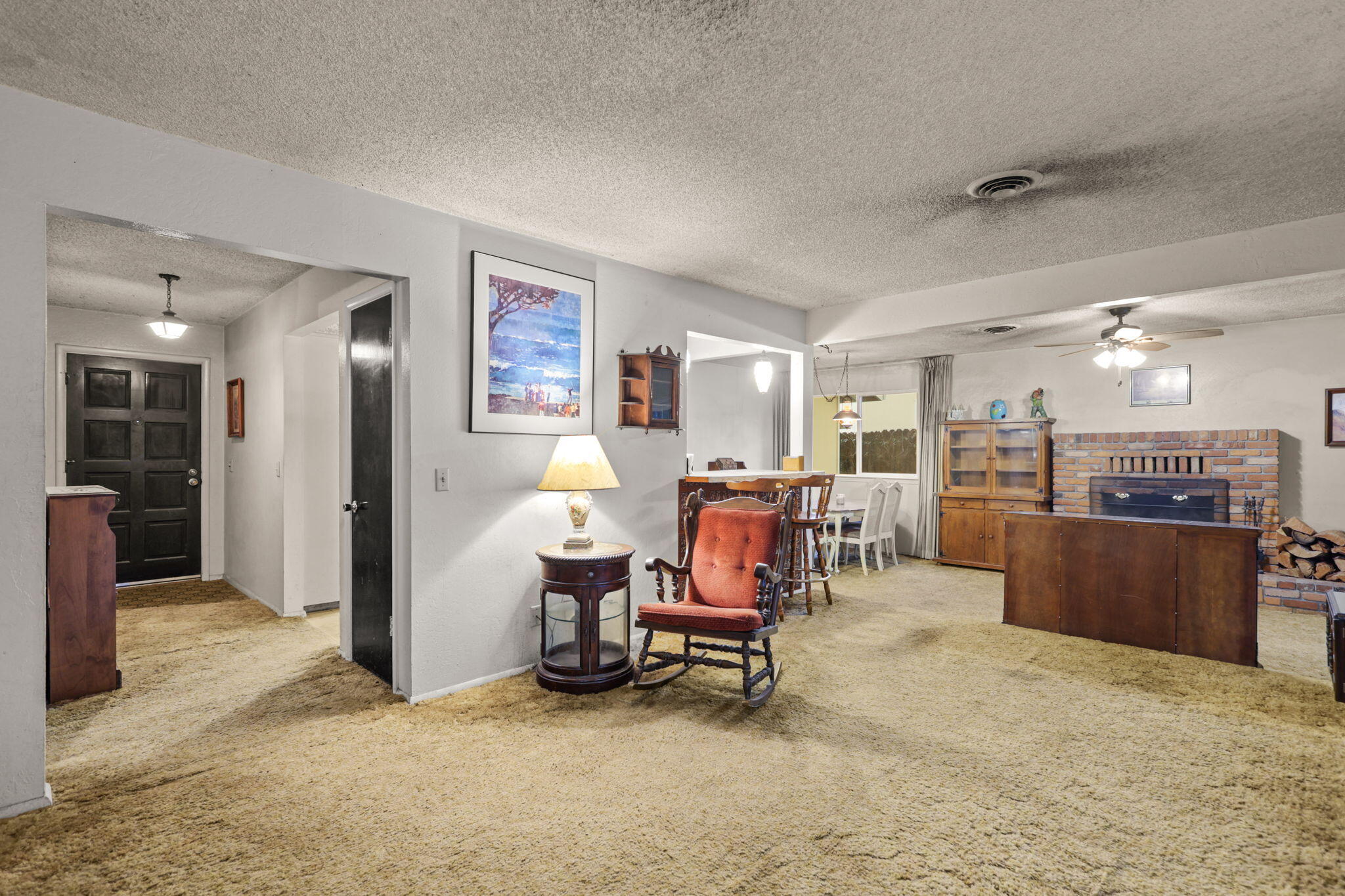 6725 Reflection Street Redding, CA 96001 - Photo 3 of 20 a view of a livingroom with furniture and a refrigerator