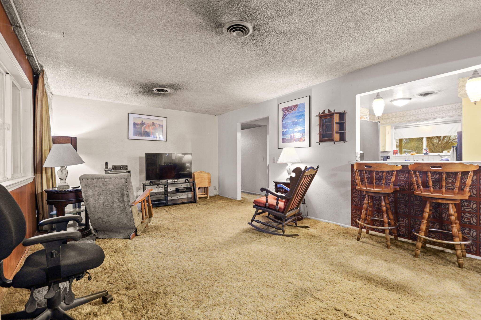 6725 Reflection Street Redding, CA 96001 - Photo 5 of 20 a view of a workspace with furniture and a window