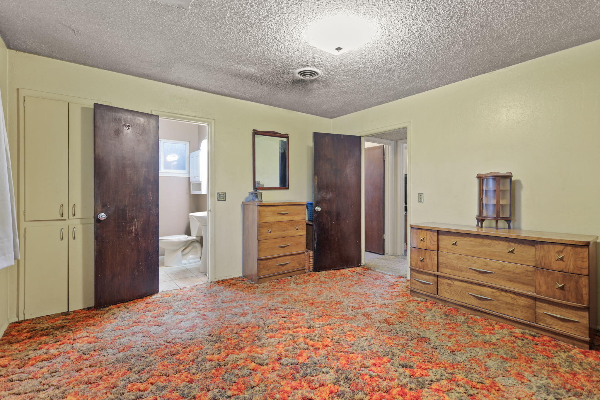 6725 Reflection Street Redding, CA 96001 - Photo 10 of 20 a view of a bedroom with closet and cabinet