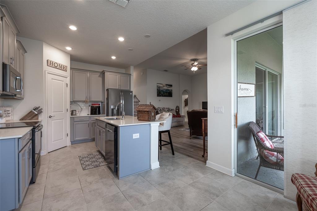9224 Southwest 60th Ct Road Ocala, FL 34476 - Photo 16 of 55 a kitchen with cabinets and refrigerator