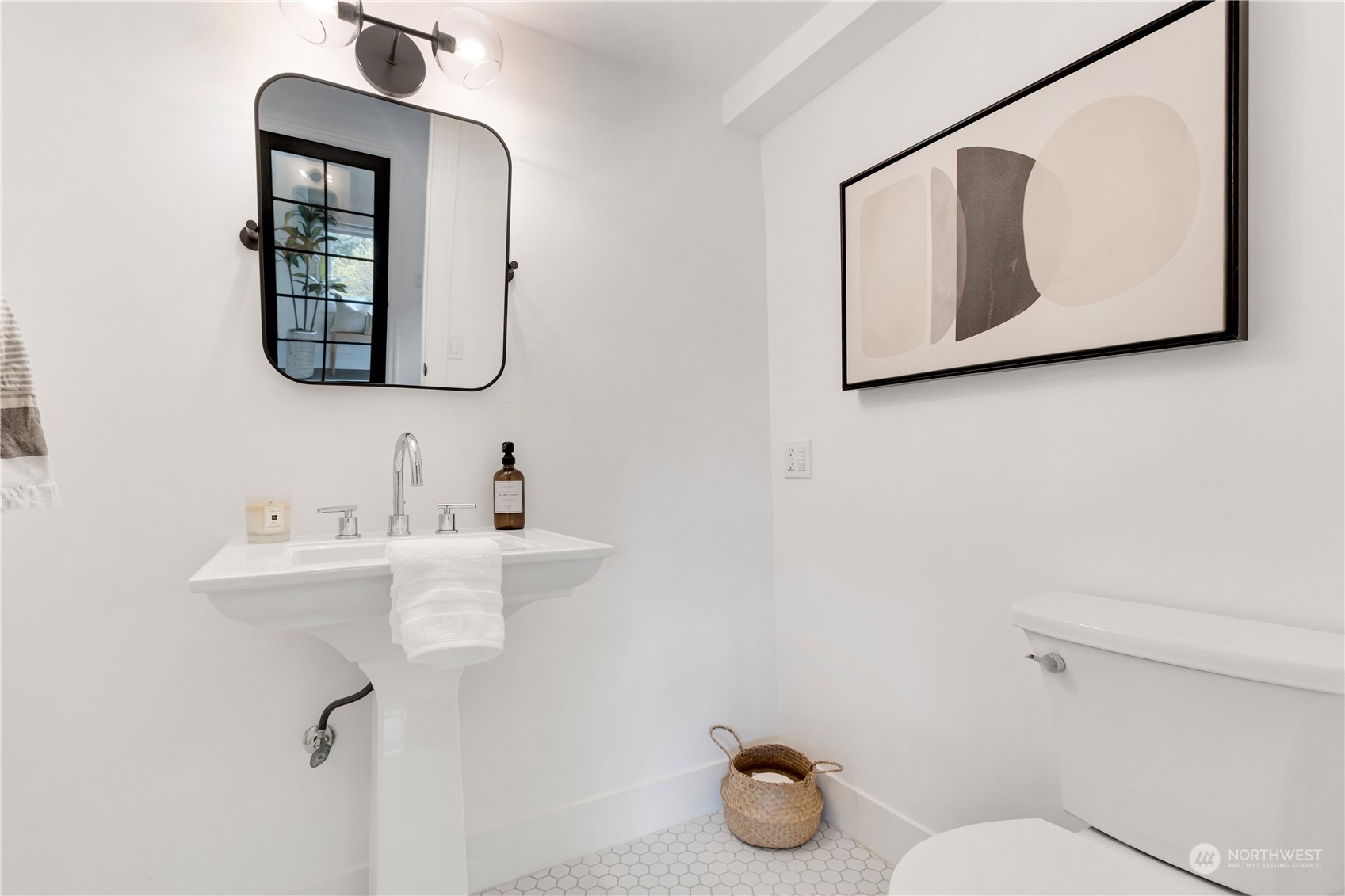 2114 North 65th Street Seattle, WA 98103 - Photo 11 of 40 a bathroom with a toilet sink and mirror
