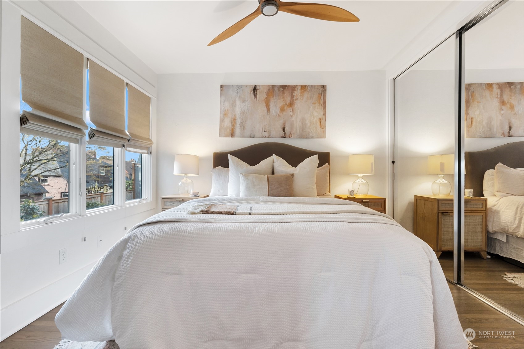 2114 North 65th Street Seattle, WA 98103 - Photo 12 of 40 a bedroom with a large bed and a large window