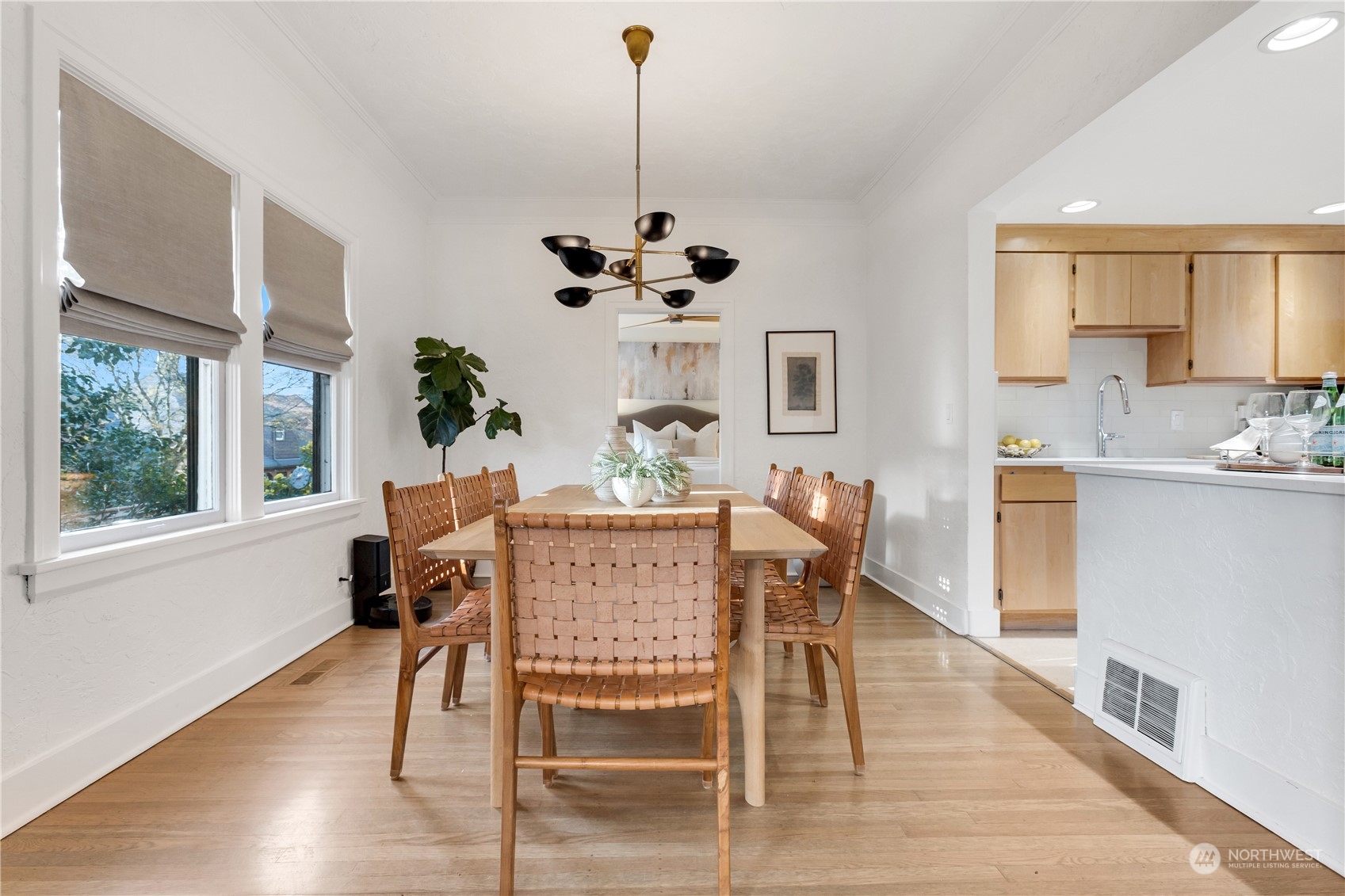 2114 North 65th Street Seattle, WA 98103 - Photo 15 of 40 a view of a dining room with furniture window and wooden floor