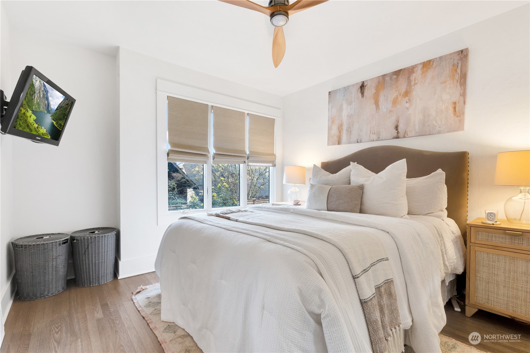 2114 North 65th Street Seattle, WA 98103 - Photo 16 of 40 a bedroom with a bed and a large window