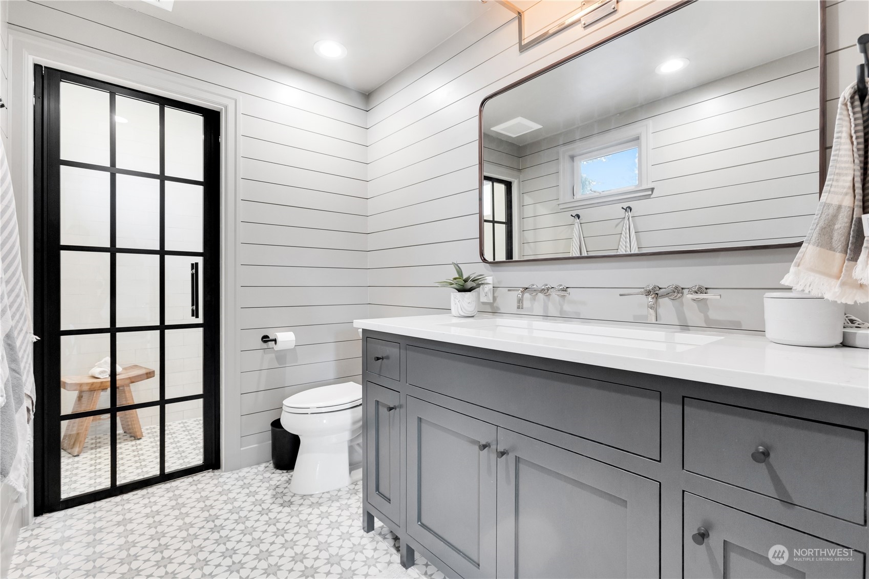 2114 North 65th Street Seattle, WA 98103 - Photo 17 of 40 a bathroom with a sink toilet and shower