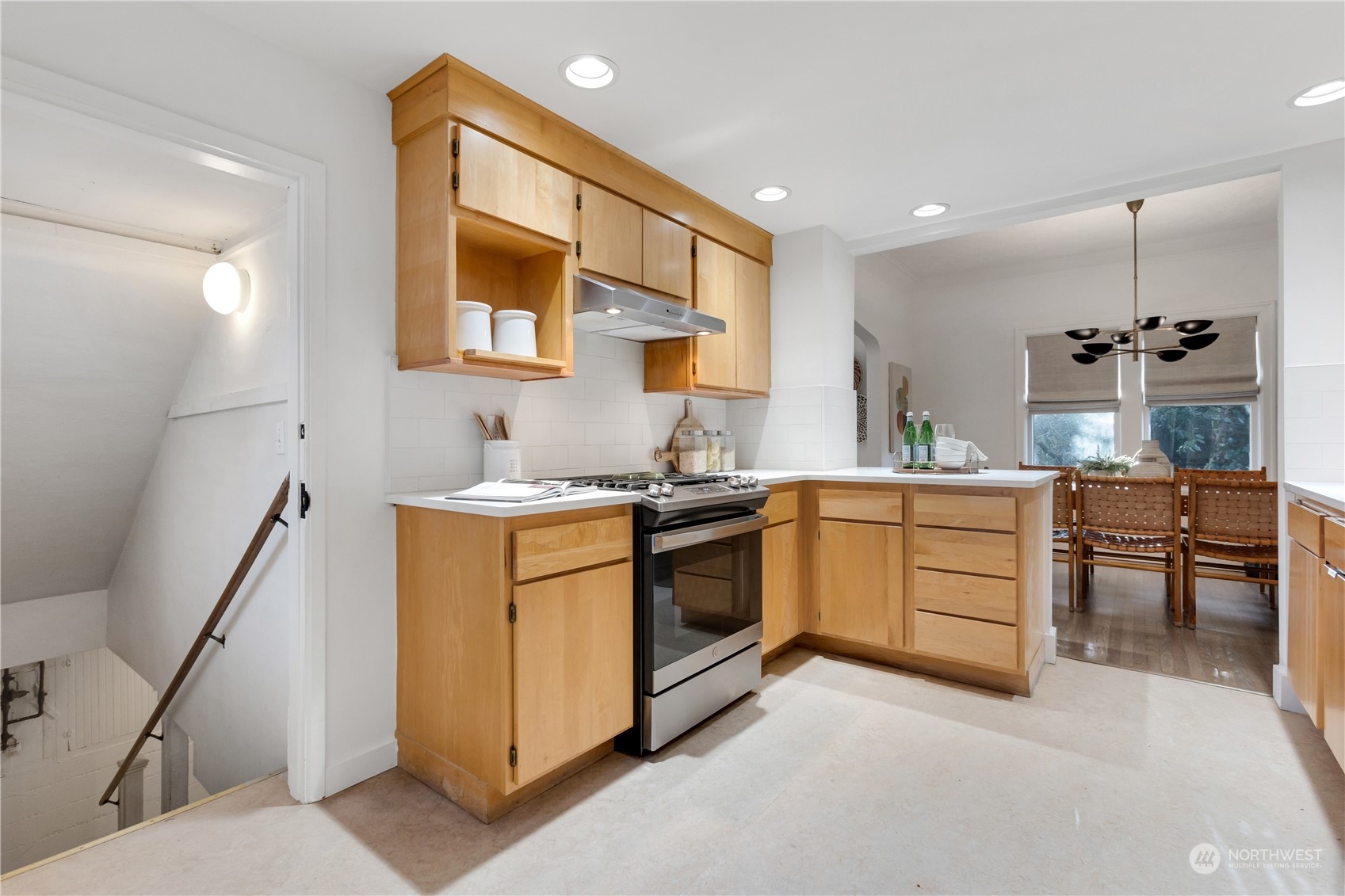 2114 North 65th Street Seattle, WA 98103 - Photo 21 of 40 a kitchen with a sink stove and cabinets
