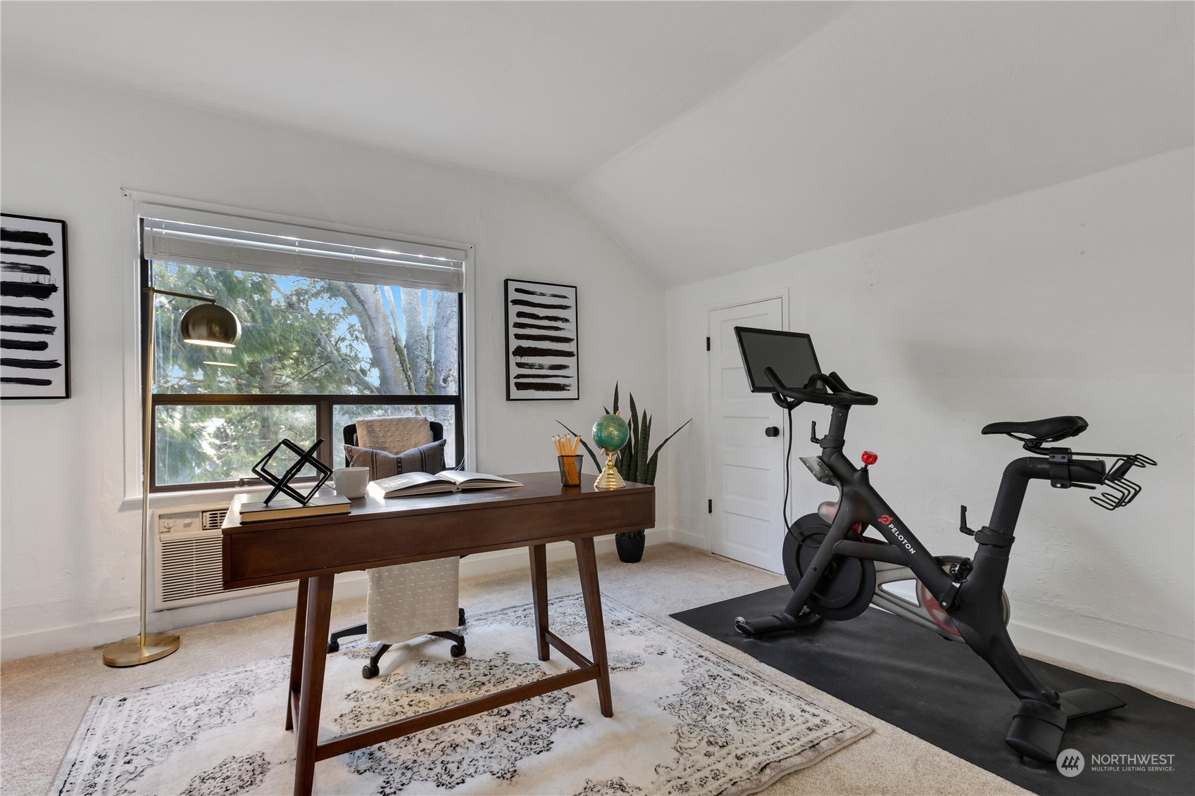 2114 North 65th Street Seattle, WA 98103 - Photo 22 of 40 a work room with furniture and a large window