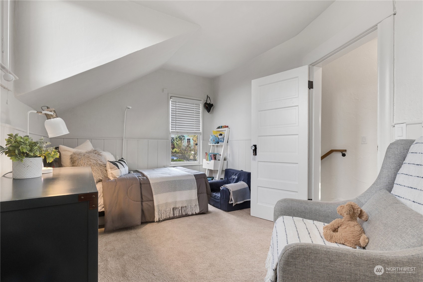 2114 North 65th Street Seattle, WA 98103 - Photo 25 of 40 a bedroom with furniture and a potted plant