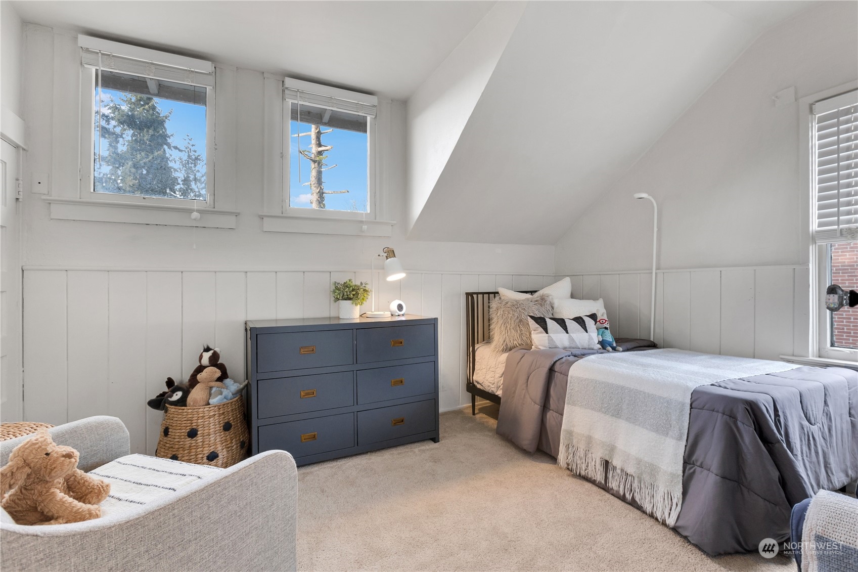 2114 North 65th Street Seattle, WA 98103 - Photo 26 of 40 a bedroom with a bed and a window