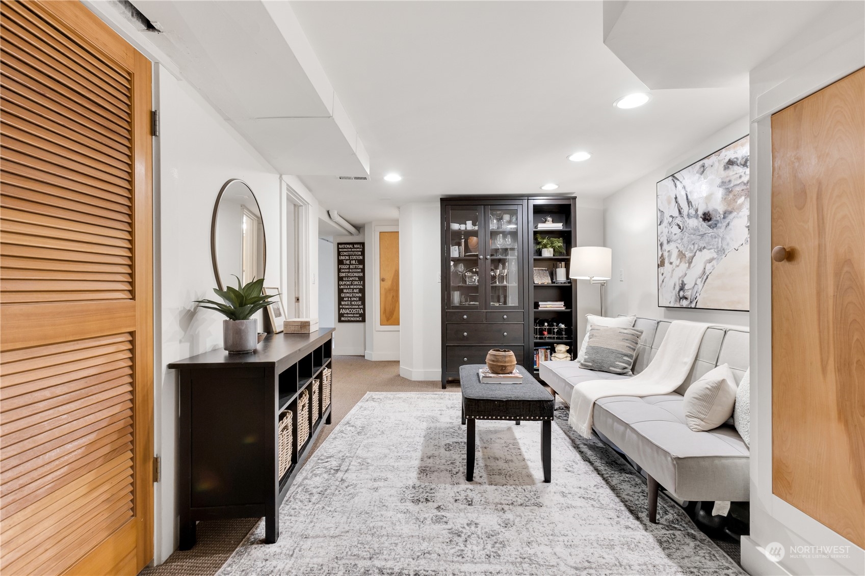 2114 North 65th Street Seattle, WA 98103 - Photo 28 of 40 a living room with furniture a rug and a painting