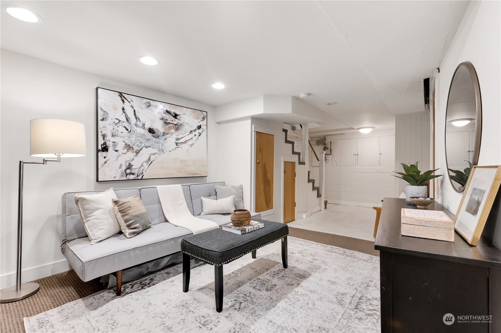 2114 North 65th Street Seattle, WA 98103 - Photo 29 of 40 a living room with furniture and a painting on the wall
