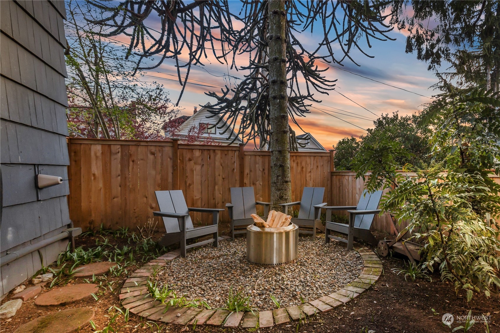 2114 North 65th Street Seattle, WA 98103 - Photo 36 of 40 a view of a chair and table in the backyard