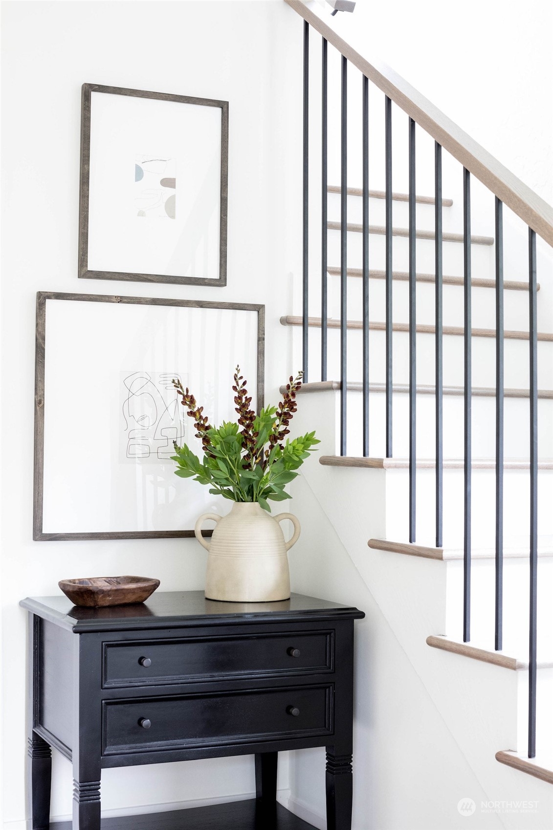 2114 North 65th Street Seattle, WA 98103 - Photo 5 of 40 a view of a vase of flowers sitting on a table