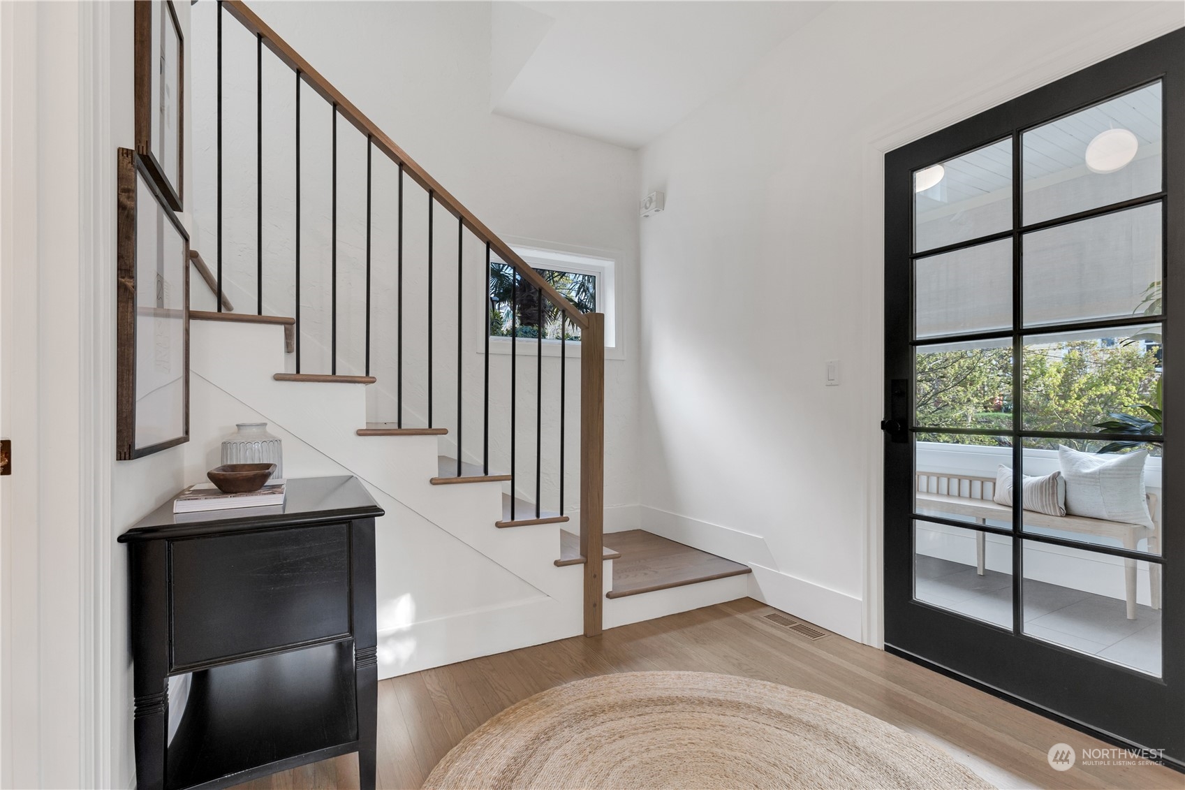2114 North 65th Street Seattle, WA 98103 - Photo 6 of 40 a view of entryway and hall with wooden floor