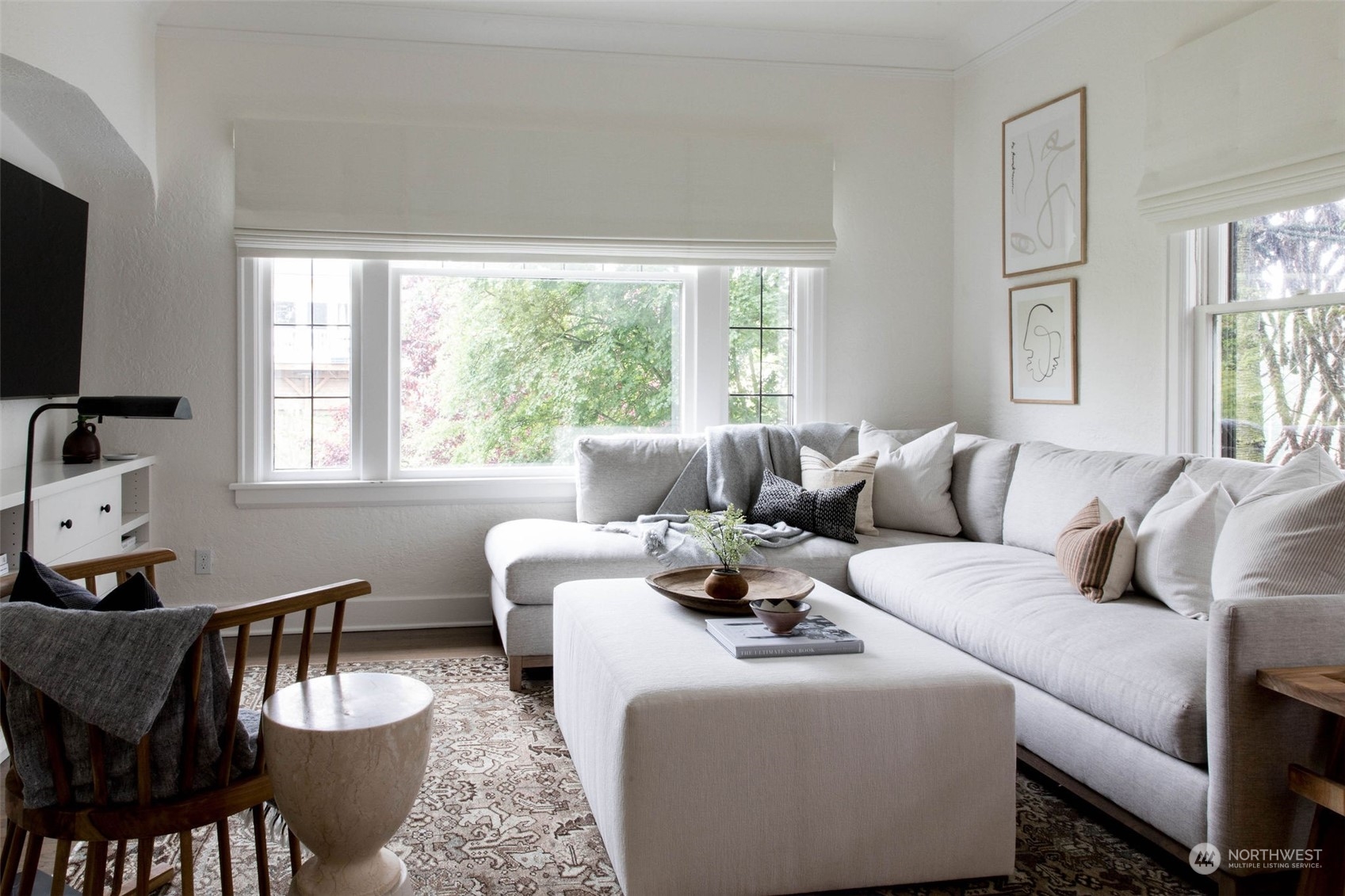 2114 North 65th Street Seattle, WA 98103 - Photo 7 of 40 a living room with furniture a flat screen tv and a window