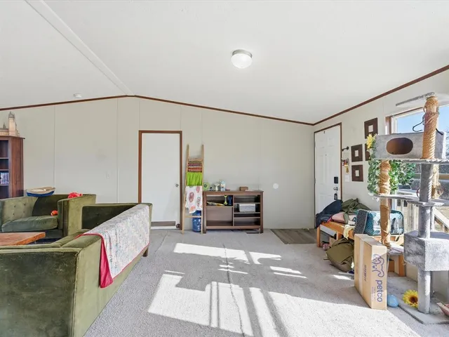 a kitchen with stainless steel appliances granite countertop a refrigerator a stove top oven a sink and dishwasher