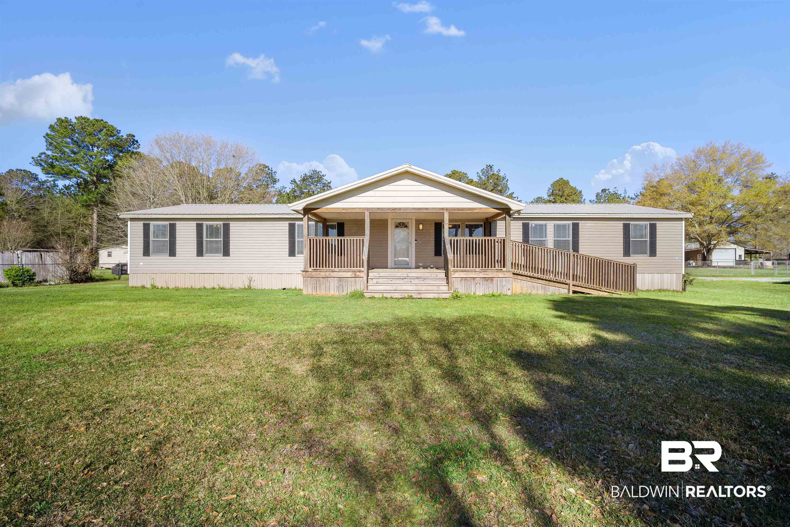 9011 Wilmer Georgetown Road Wilmer, AL 36587 - Photo 1 of 34 Manufactured / mobile home with a front lawn and a porch