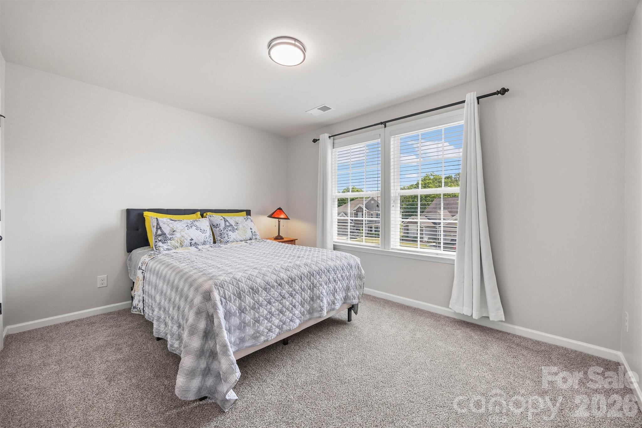 299 Annatto Way Tega Cay, SC 29708 - Photo 31 of 46 a bedroom with a bed and a window
