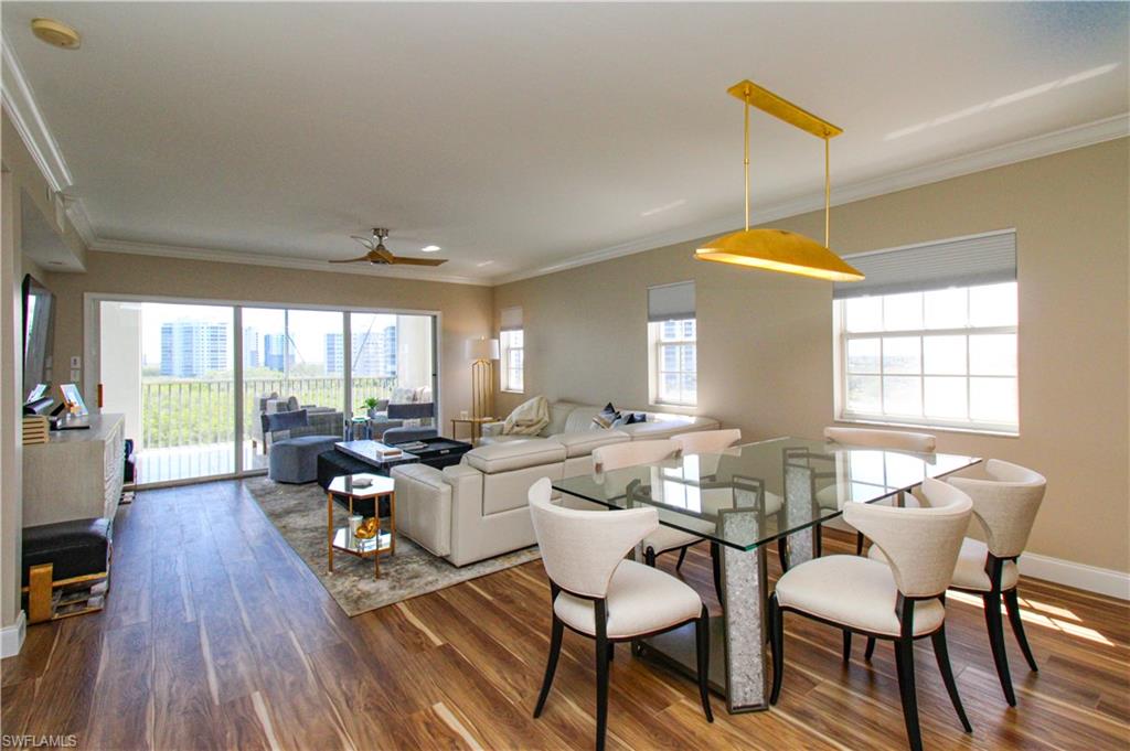 35 Bluebill Avenue, Unit B702 Naples, FL 34108 - Photo 27 of 50 a view of a dining room with furniture window and outside view