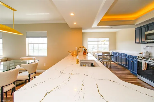 a large white room with a large bed and furniture