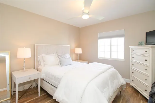 a bedroom with a bed and a dresser in it