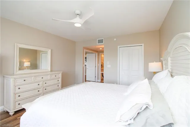 a bedroom with a bed and a dresser