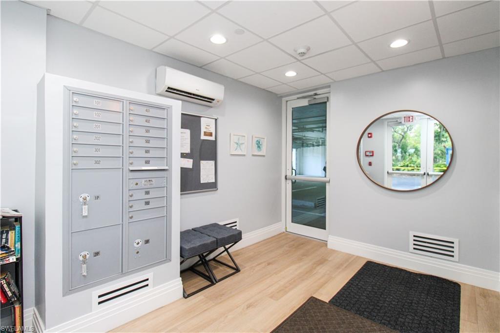 35 Bluebill Avenue, Unit B702 Naples, FL 34108 - Photo 49 of 50 a view of a workspace with furniture and a window