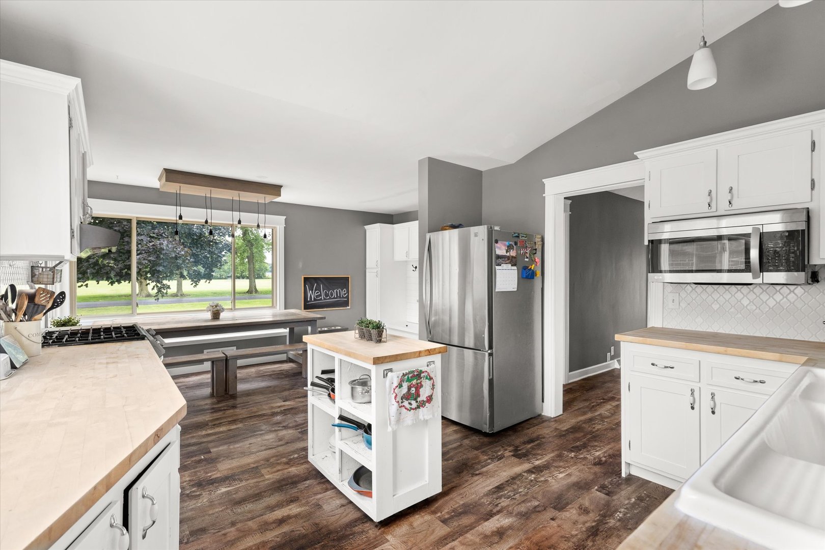 290 West Southmor Road Morris, IL 60450 - Photo 3 of 34 a kitchen with stainless steel appliances a stove a sink and a refrigerator