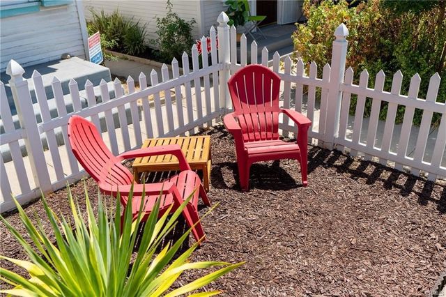 a view of a chairs and table in the patio