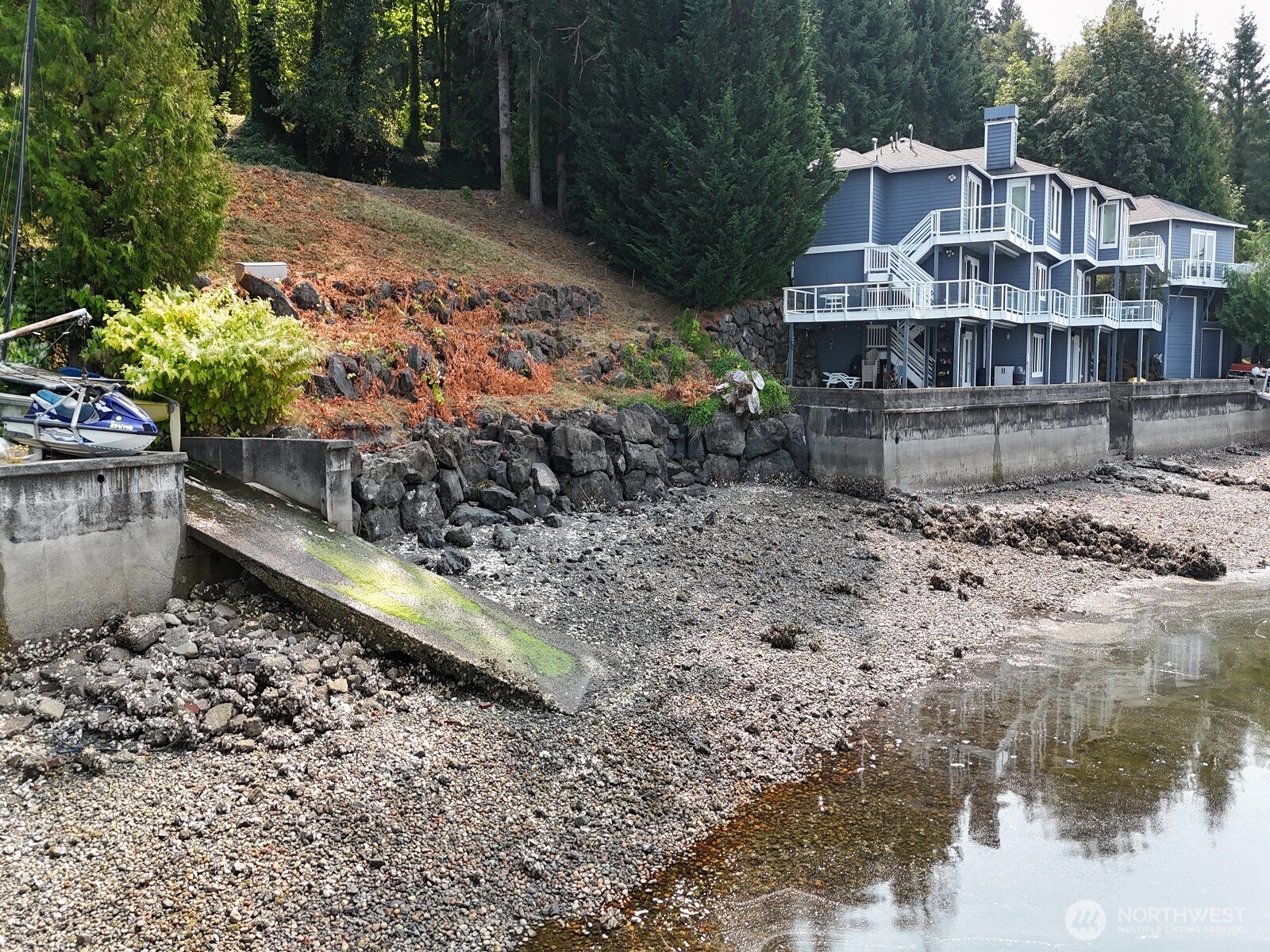 17871 Highway 106 Belfair, WA 98528 - Photo 18 of 18 a view of a house with a yard and a wooden fence