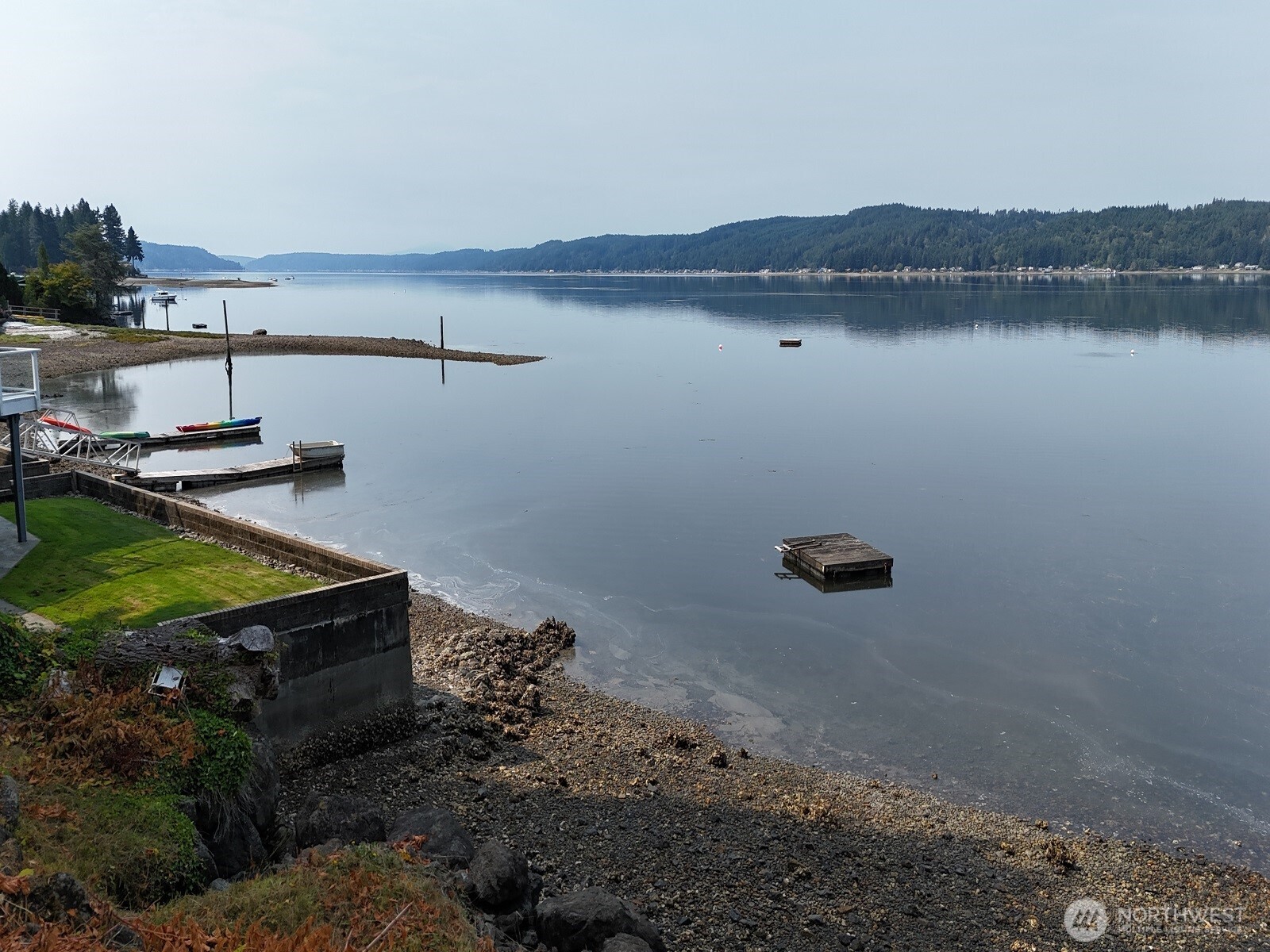 17871 Highway 106 Belfair, WA 98528 - Photo 3 of 18 a view of a backyard with plants and lake view