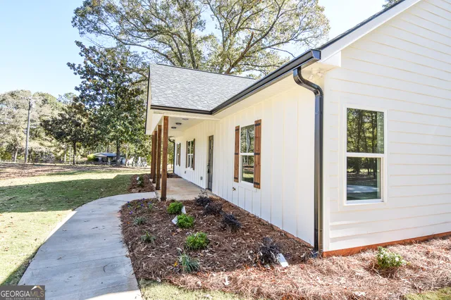 a view of kitchen with refrigerator microwave and stove
