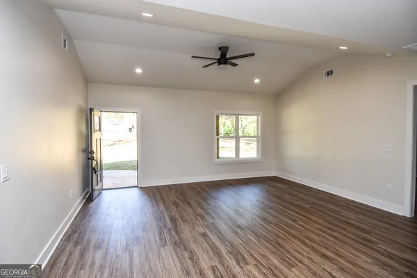 a kitchen with a sink cabinets and window