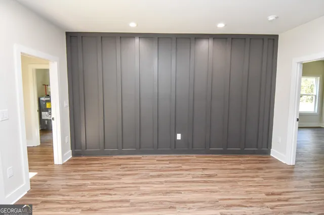 a bathroom with a sink and mirror with toilet